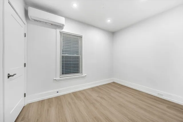 a view of a room that has wooden floor in it