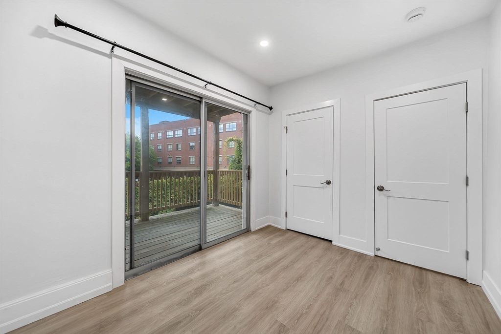 92 Willow Street, Unit 2 Cambridge, MA 02141 - Photo 9 of 20 a view of entryway with wooden floor