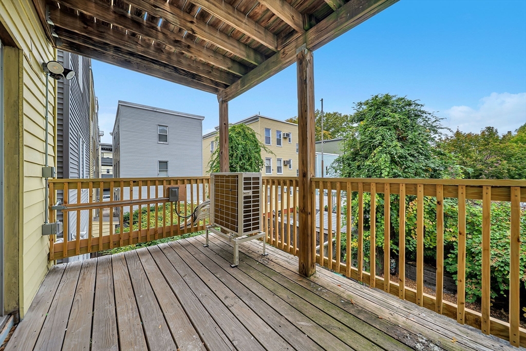 92 Willow Street, Unit 2 Cambridge, MA 02141 - Photo 10 of 20 a view of a balcony with wooden floor