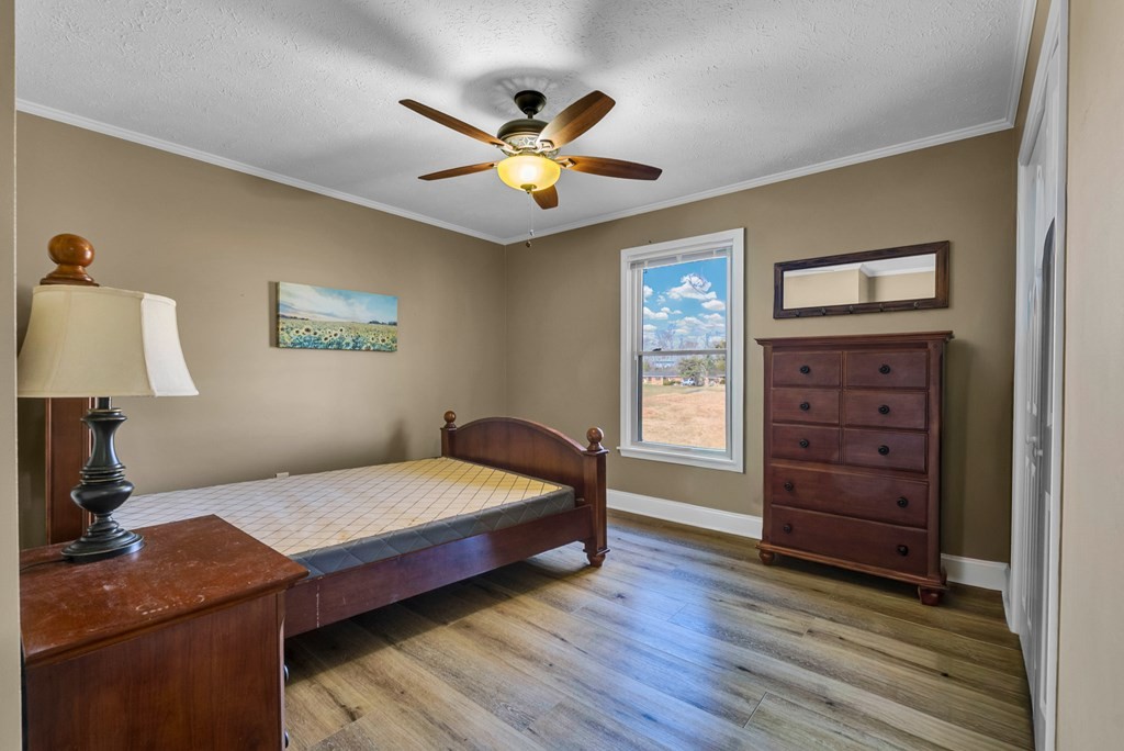 1868 Herbert Garrett Road Cookeville, TN 38506 - Photo 14 of 47 a bedroom with a bed and a dresser