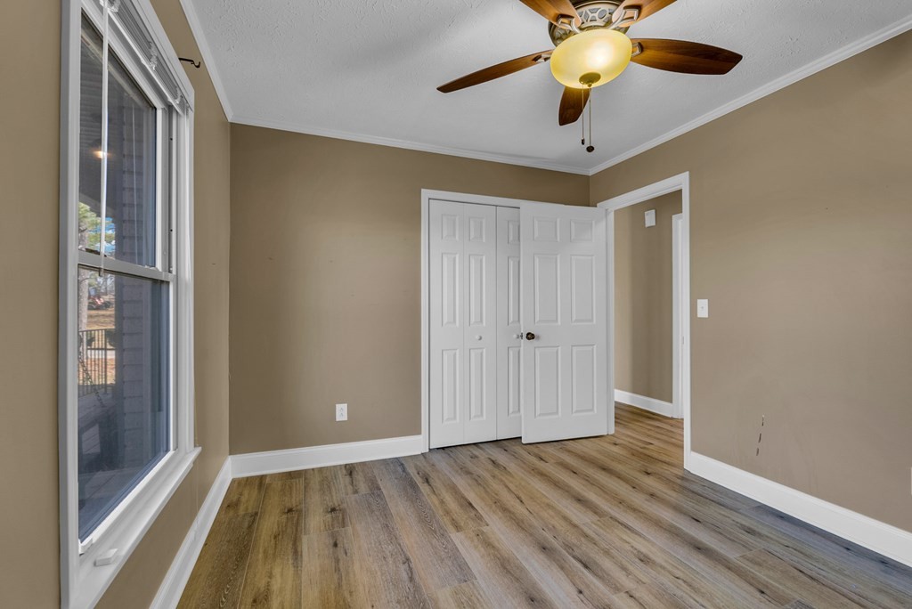 1868 Herbert Garrett Road Cookeville, TN 38506 - Photo 16 of 47 a view of an empty room with window and wooden floor