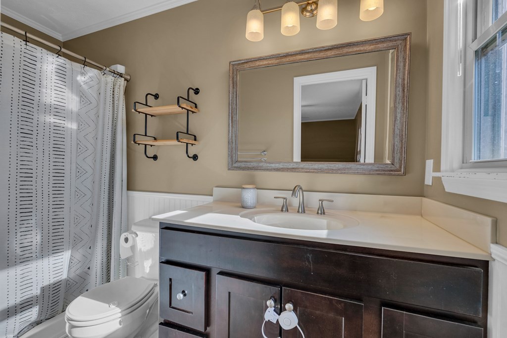 1868 Herbert Garrett Road Cookeville, TN 38506 - Photo 17 of 47 a bathroom with a sink a toilet and shower