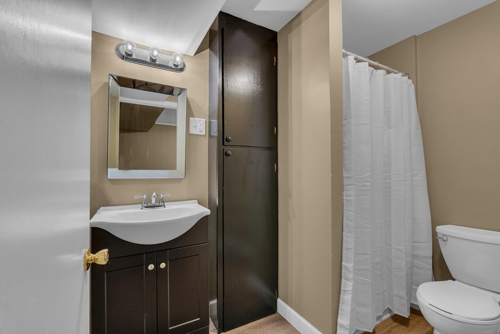 1868 Herbert Garrett Road Cookeville, TN 38506 - Photo 18 of 47 a bathroom with a sink toilet and shower