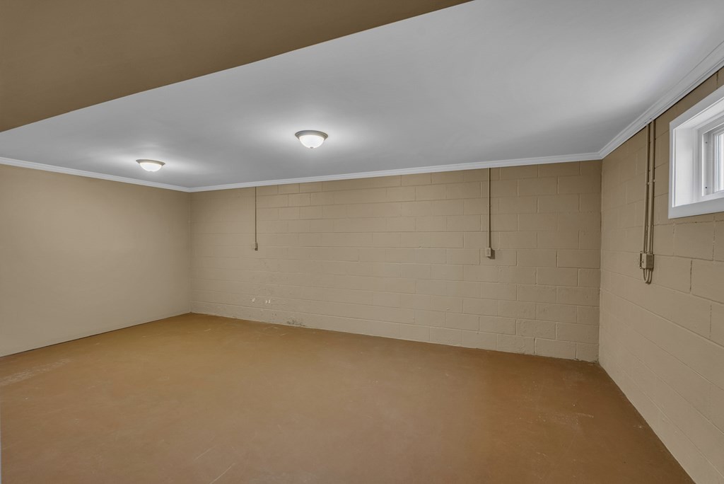 1868 Herbert Garrett Road Cookeville, TN 38506 - Photo 23 of 47 an empty room with a empty space and windows