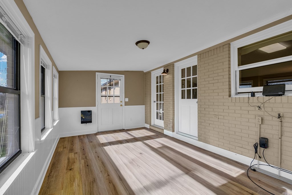 1868 Herbert Garrett Road Cookeville, TN 38506 - Photo 26 of 47 a spacious bedroom with a bed and a flat screen tv