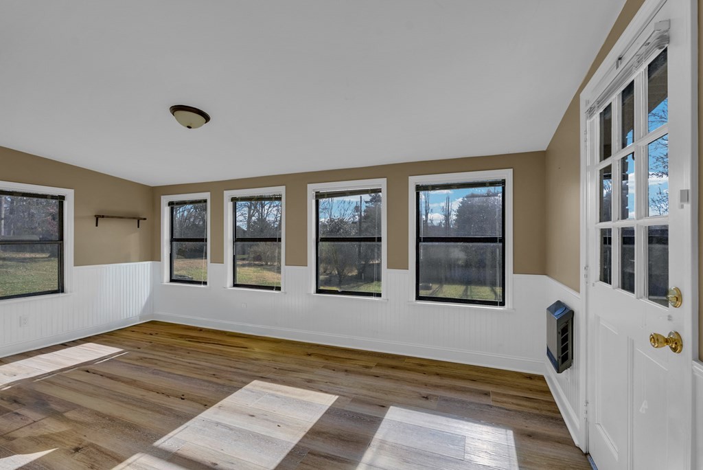 1868 Herbert Garrett Road Cookeville, TN 38506 - Photo 27 of 47 a view of an empty room with wooden floor and a window