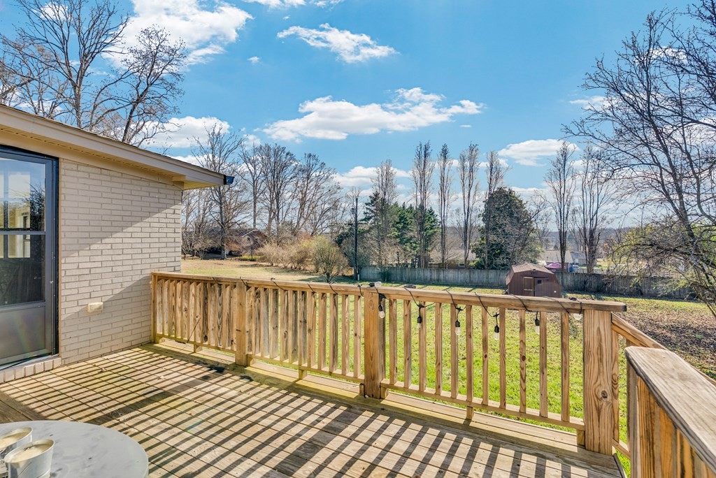 1868 Herbert Garrett Road Cookeville, TN 38506 - Photo 31 of 47 a view of a balcony with wooden floor and fence