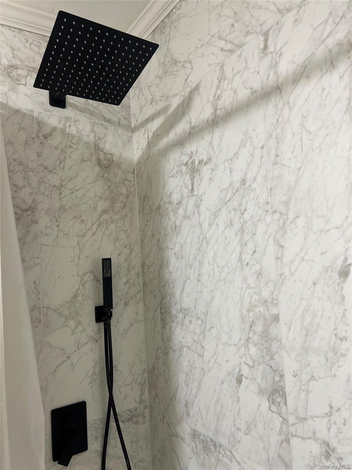 2 Secora Road, Unit 16 Monsey, NY 10952 - Photo 14 of 15 Renovated bathroom with new shower tile, rain head and handheld