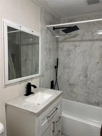 a bathroom with a sink and a mirror