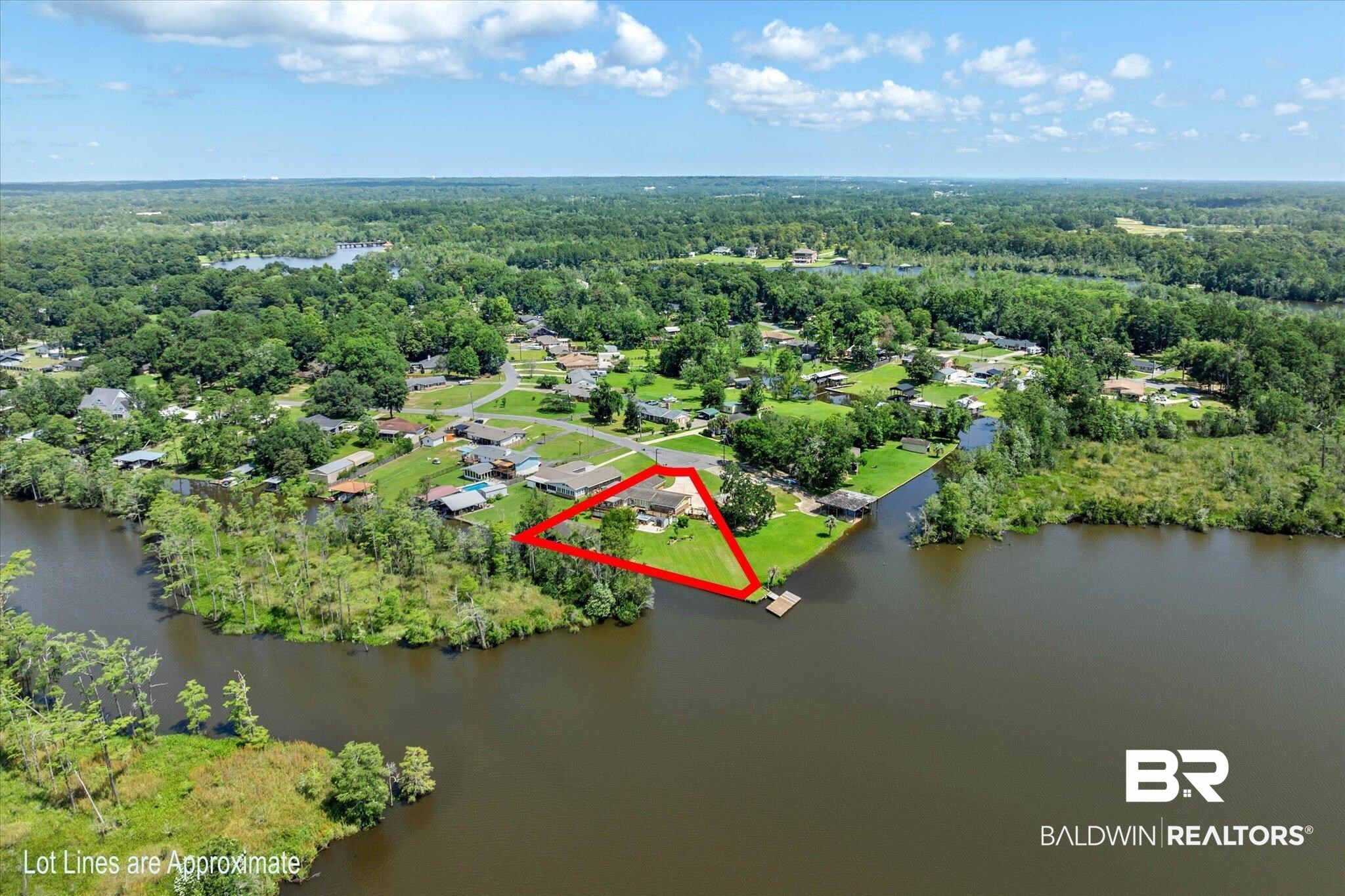 3801 Point Road Mobile, AL 36619 - Photo 46 of 55 Waterfront property with extensive green space, a private boat dock, and a single-story residence