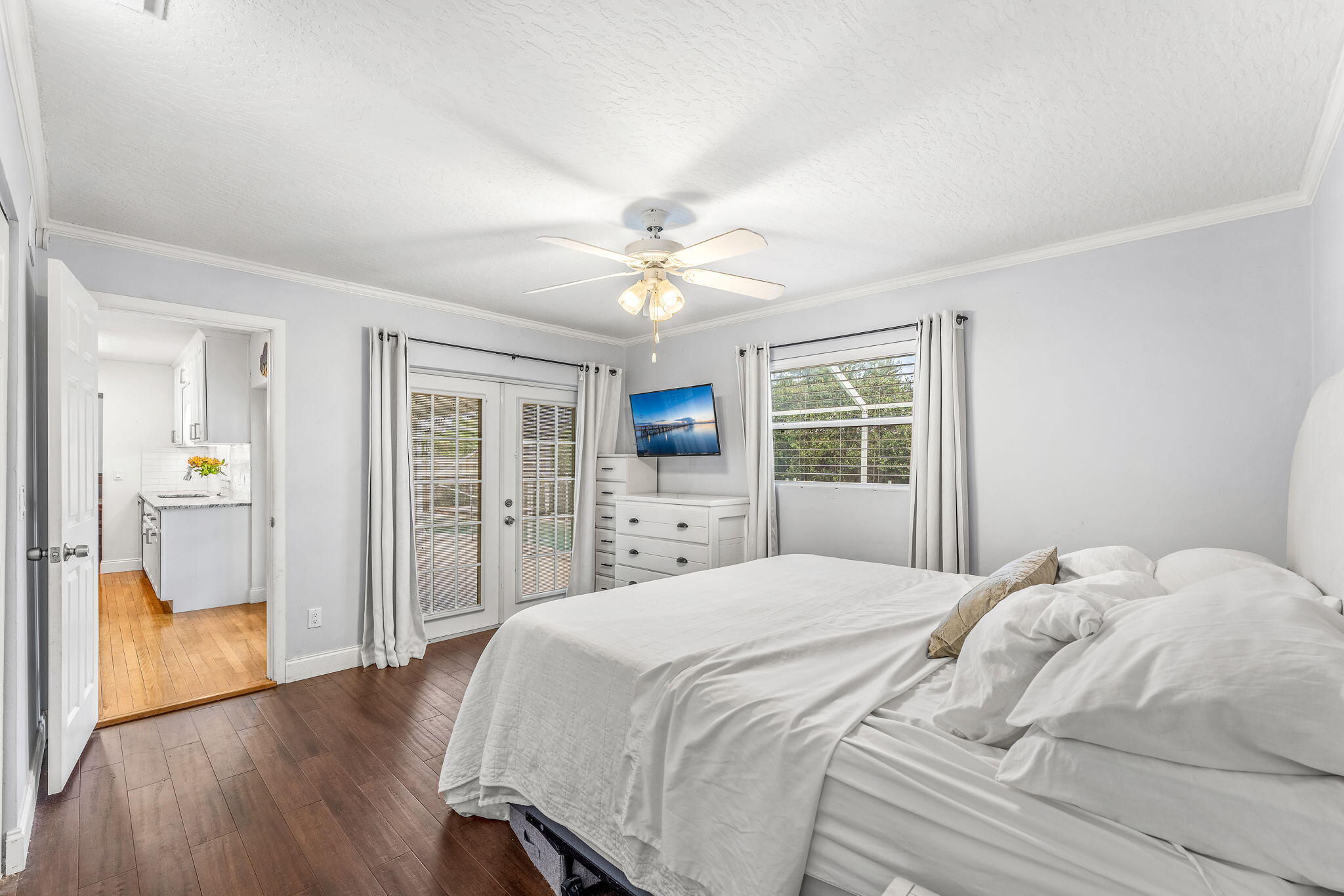 680 Mark Drive Melbourne, FL 32904 - Photo 11 of 36 a bedroom with a large bed and a window