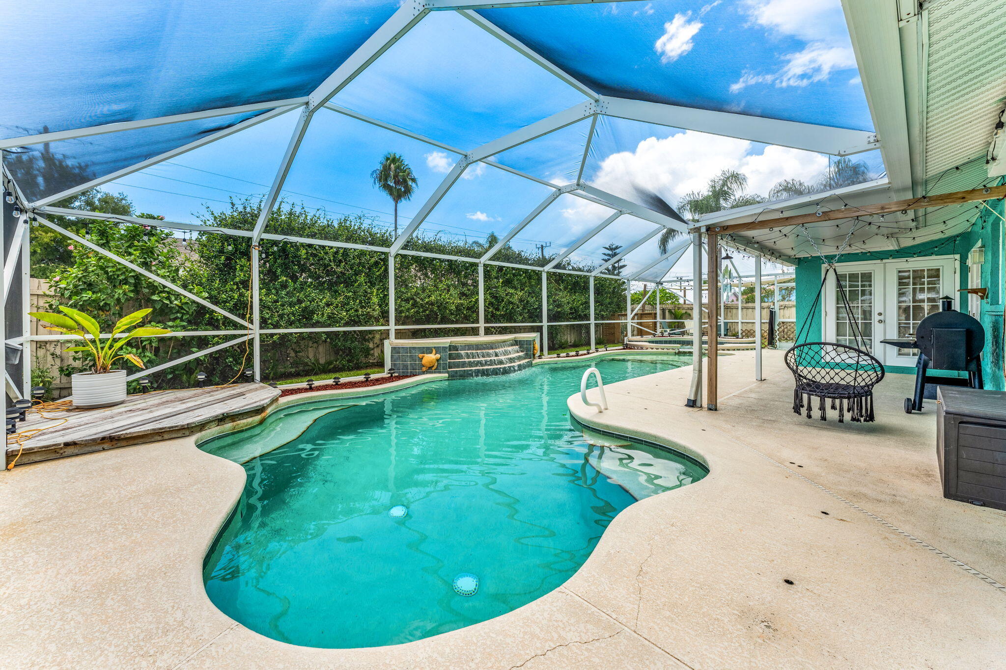 680 Mark Drive Melbourne, FL 32904 - Photo 19 of 36 a view of a swimming pool with a patio