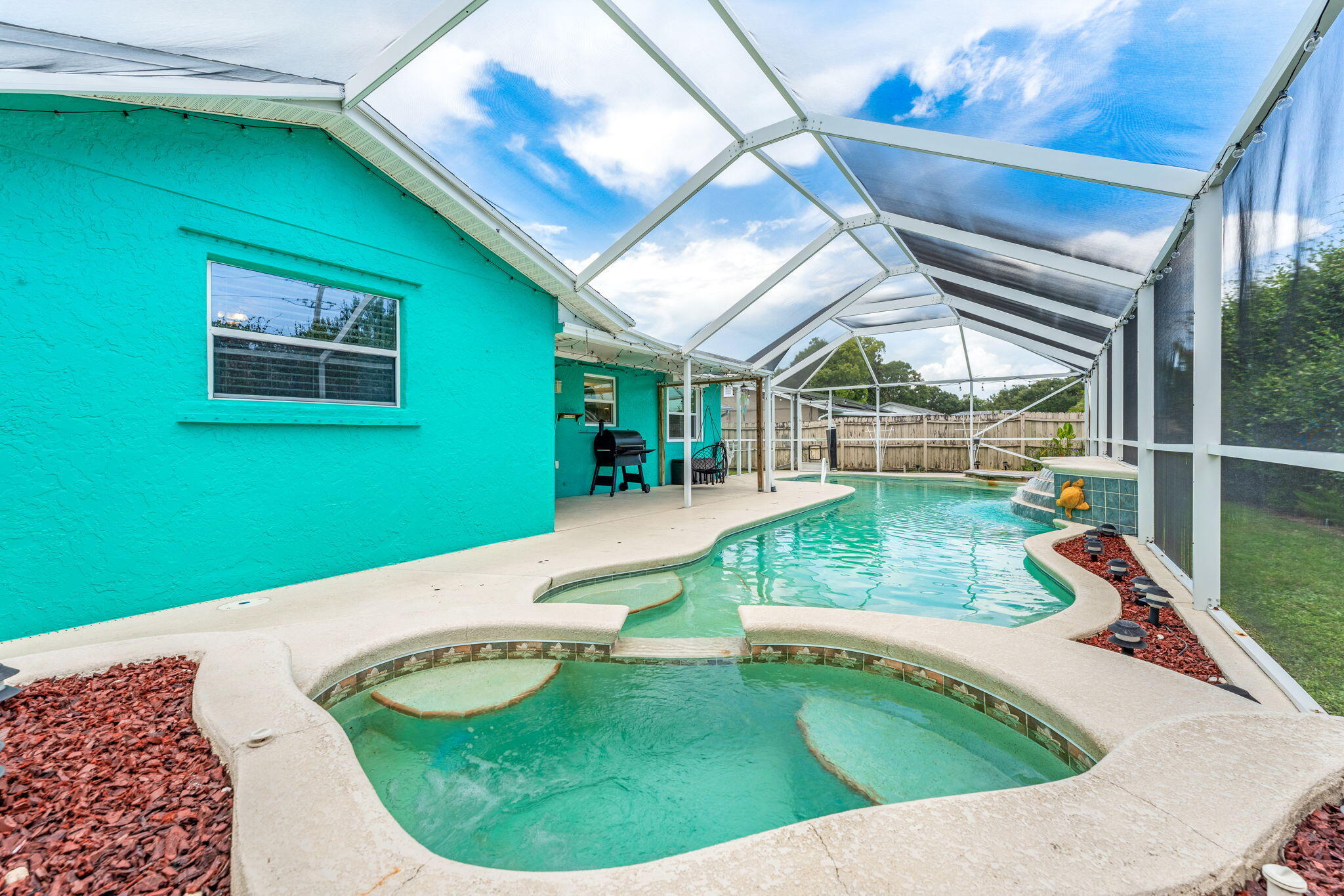 680 Mark Drive Melbourne, FL 32904 - Photo 2 of 36 a view of a house with a swimming pool