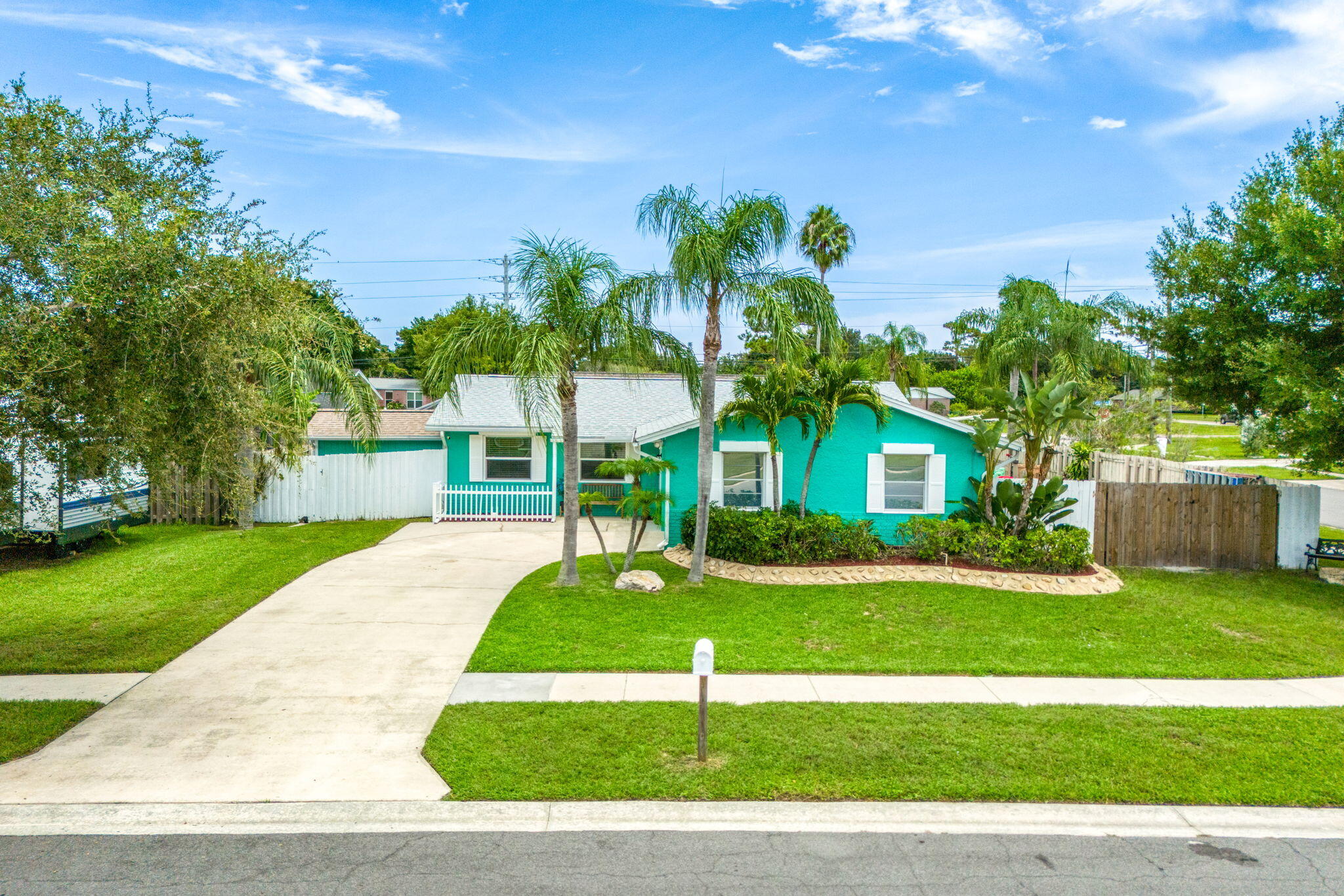 680 Mark Drive Melbourne, FL 32904 - Photo 26 of 36 a front view of a house with a yard and garage