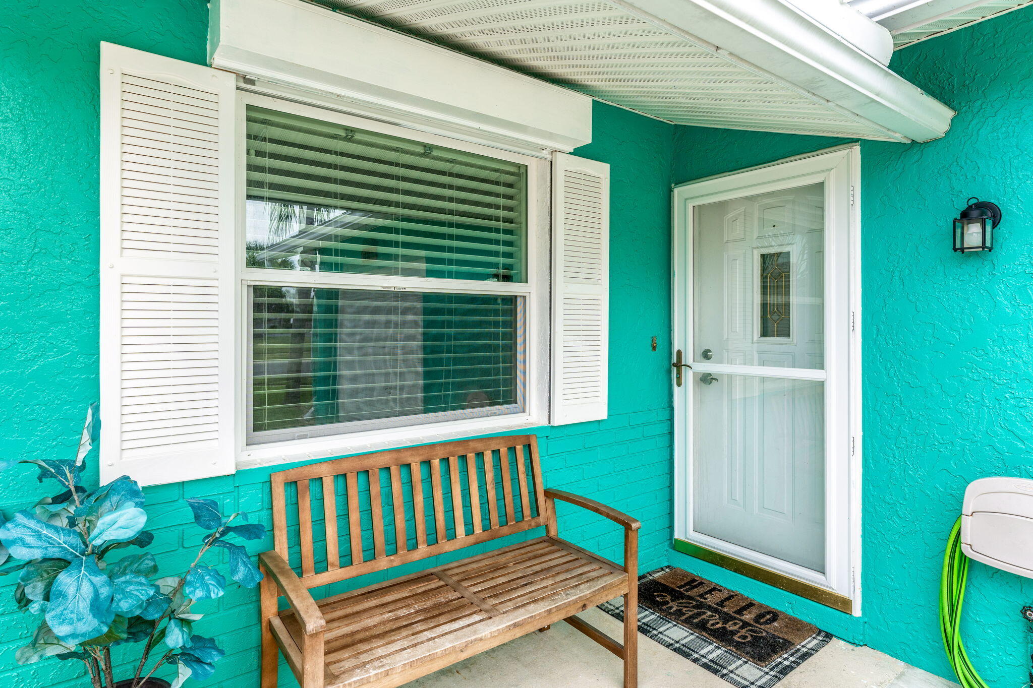 680 Mark Drive Melbourne, FL 32904 - Photo 28 of 36 a view of a porch with a bench