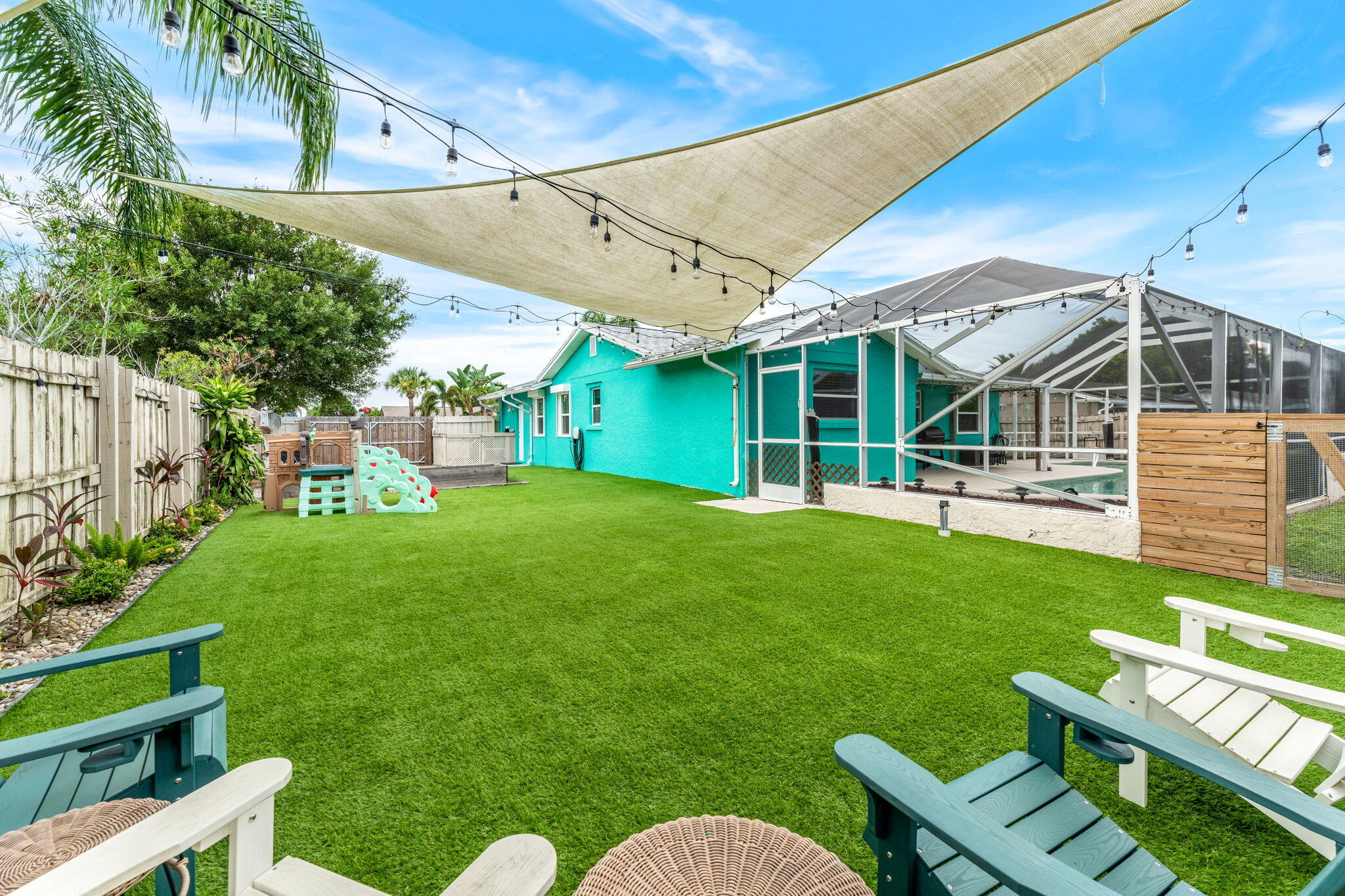 680 Mark Drive Melbourne, FL 32904 - Photo 3 of 36 a view of a chair and table in the backyard