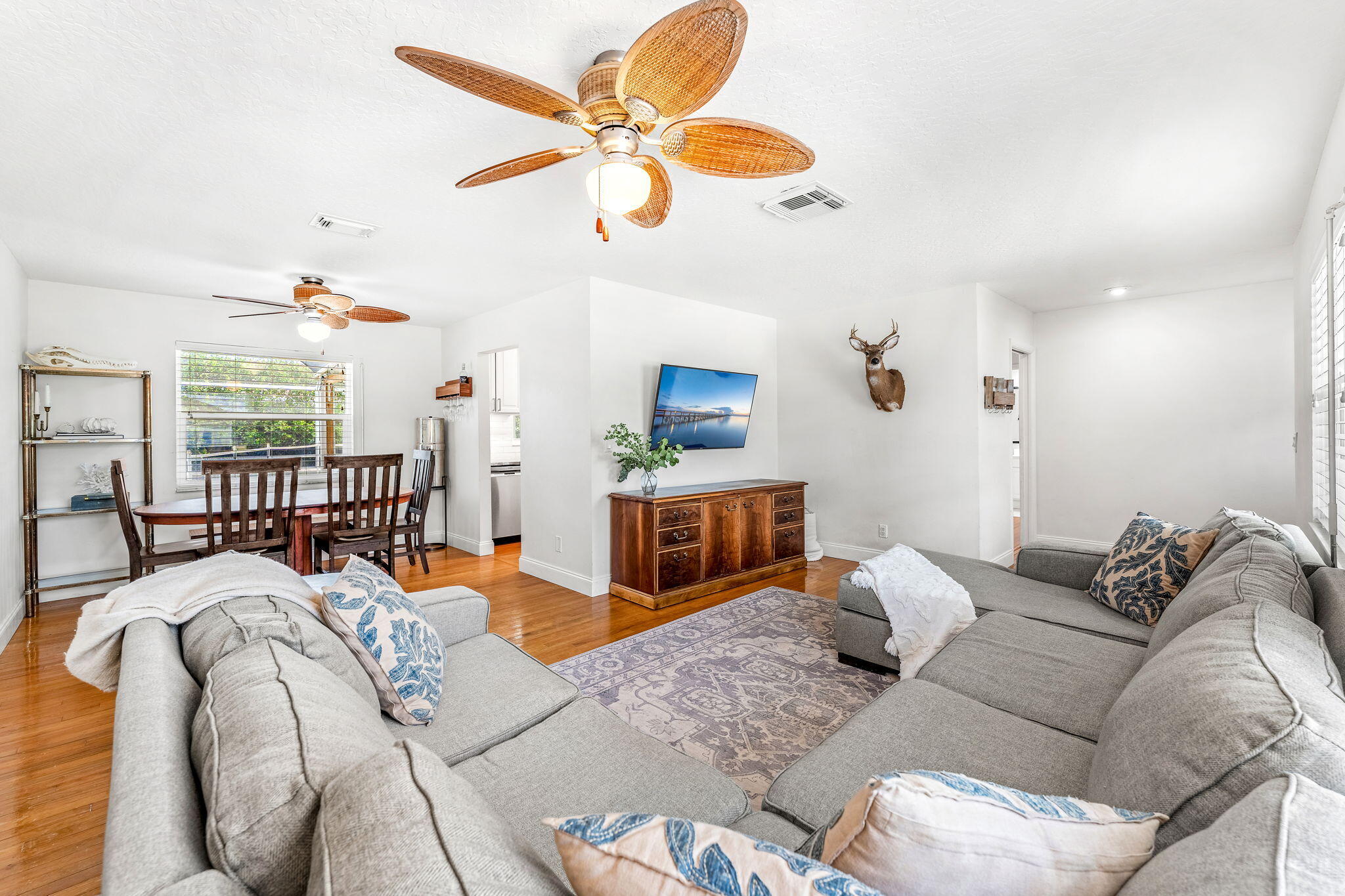 680 Mark Drive Melbourne, FL 32904 - Photo 4 of 36 a living room with furniture ceiling fan and a rug