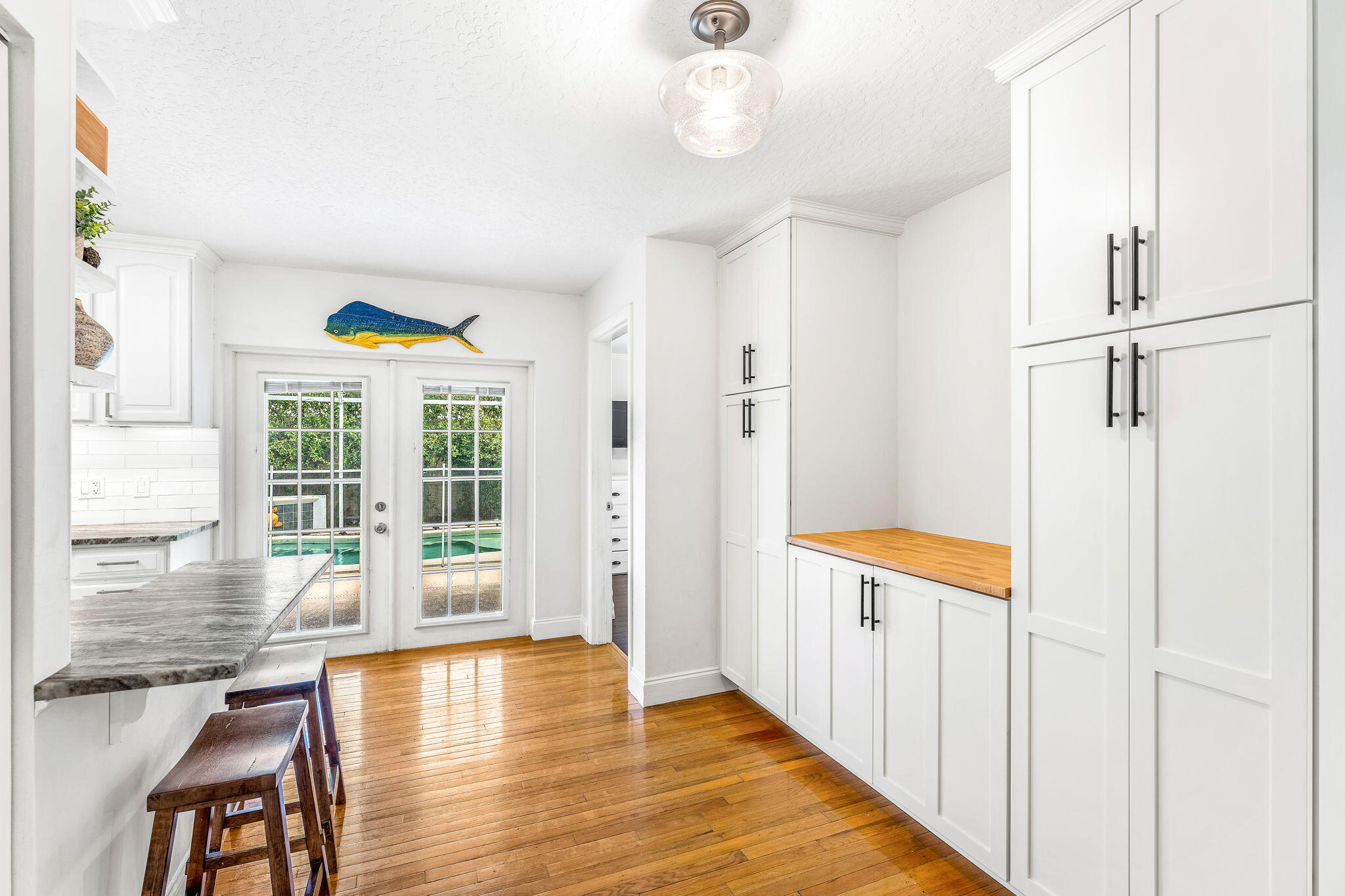 680 Mark Drive Melbourne, FL 32904 - Photo 10 of 36 a view of a hallway with wooden floor and chandelier