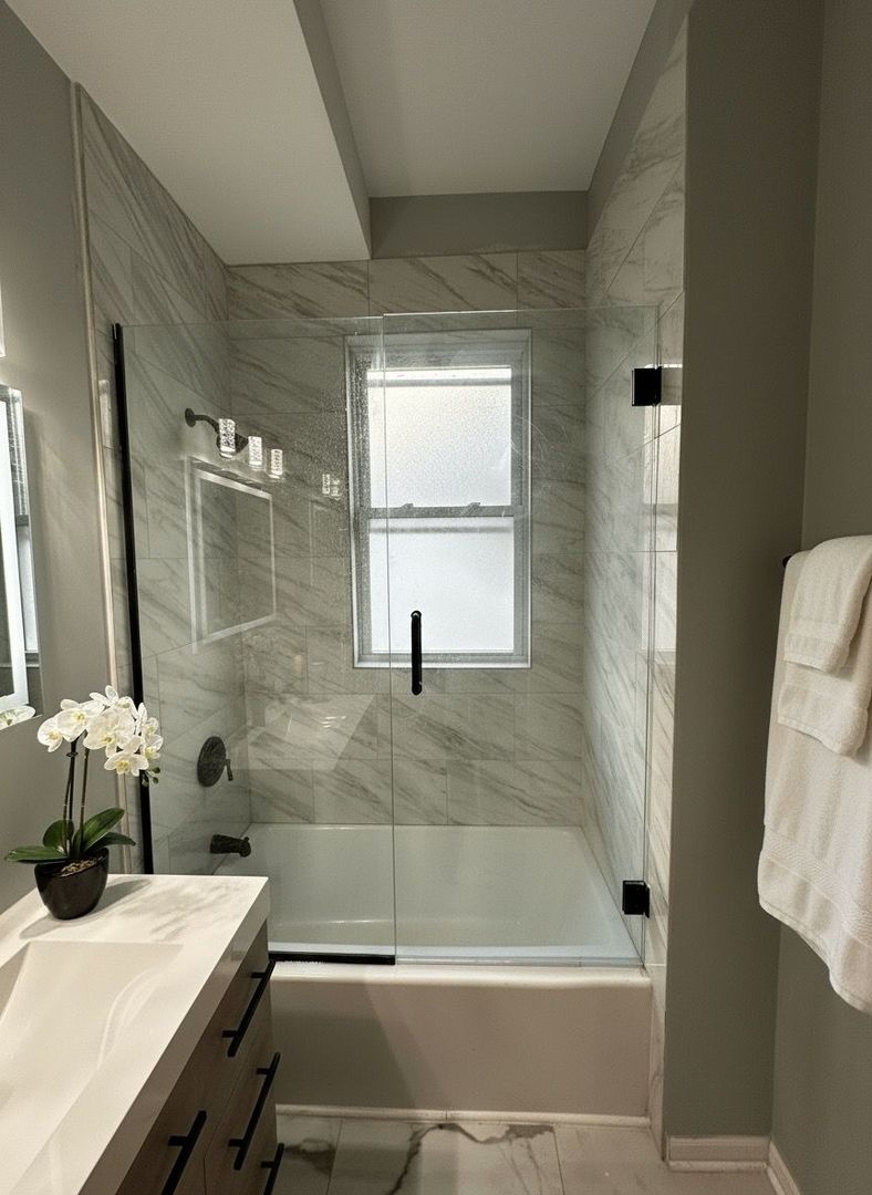 62 West 113th Street Chicago, IL 60628 - Photo 24 of 54 a bathroom with a tub sink and mirror