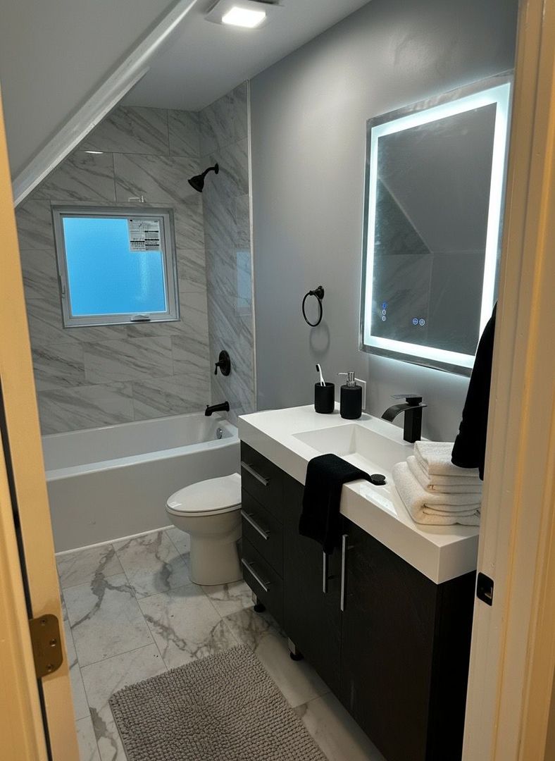 62 West 113th Street Chicago, IL 60628 - Photo 36 of 54 a bathroom with a sink a toilet and shower