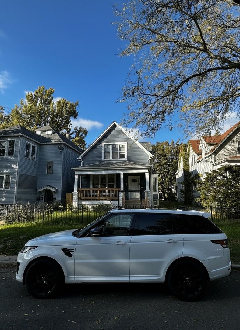 62 West 113th Street Chicago, IL 60628 - Photo 53 of 54 a view of a car parked in front of a brick house