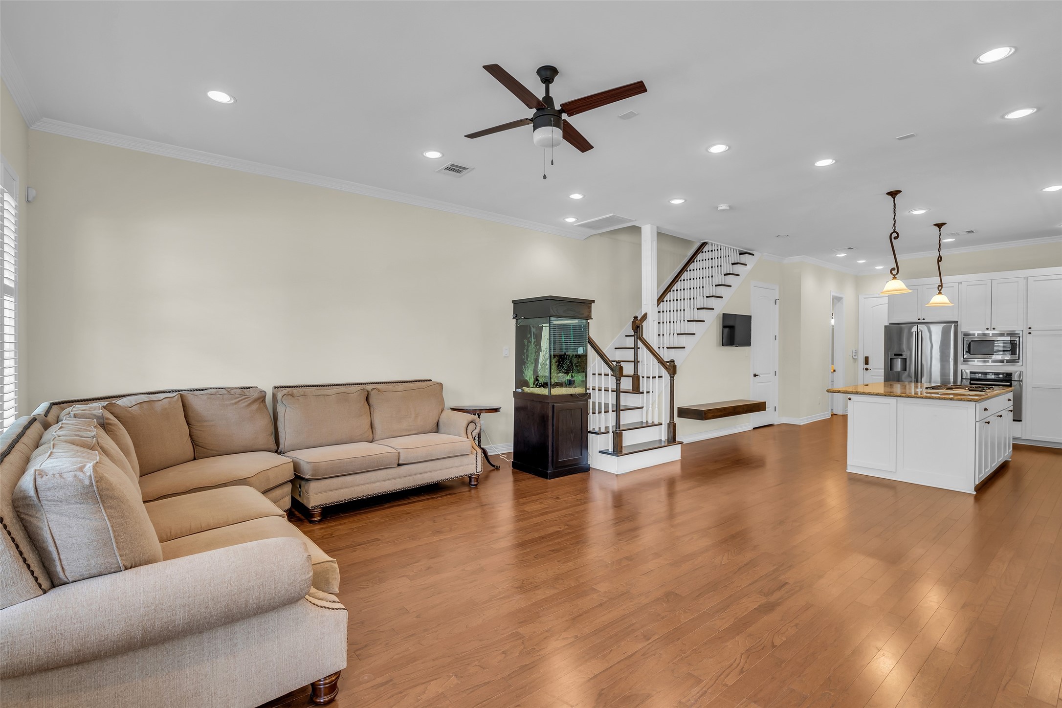 1423 Colorado Street Houston, TX 77007 - Photo 5 of 28 Just beyond the living room are the dining area and kitchen, creating a seamless open layout that supports easy movement and everyday functionality.