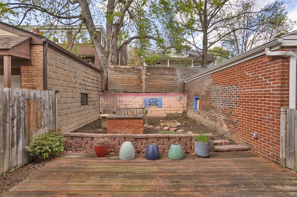 7543 Rosemary Road Pittsburgh, PA 15221 - Photo 32 of 39 Rear deck and campfire/grilling area