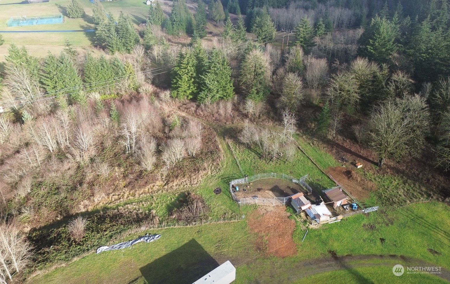 7608 Southwest Scatter View Lane Rochester, WA 98579 - Photo 3 of 23 an aerial view of a house with a yard