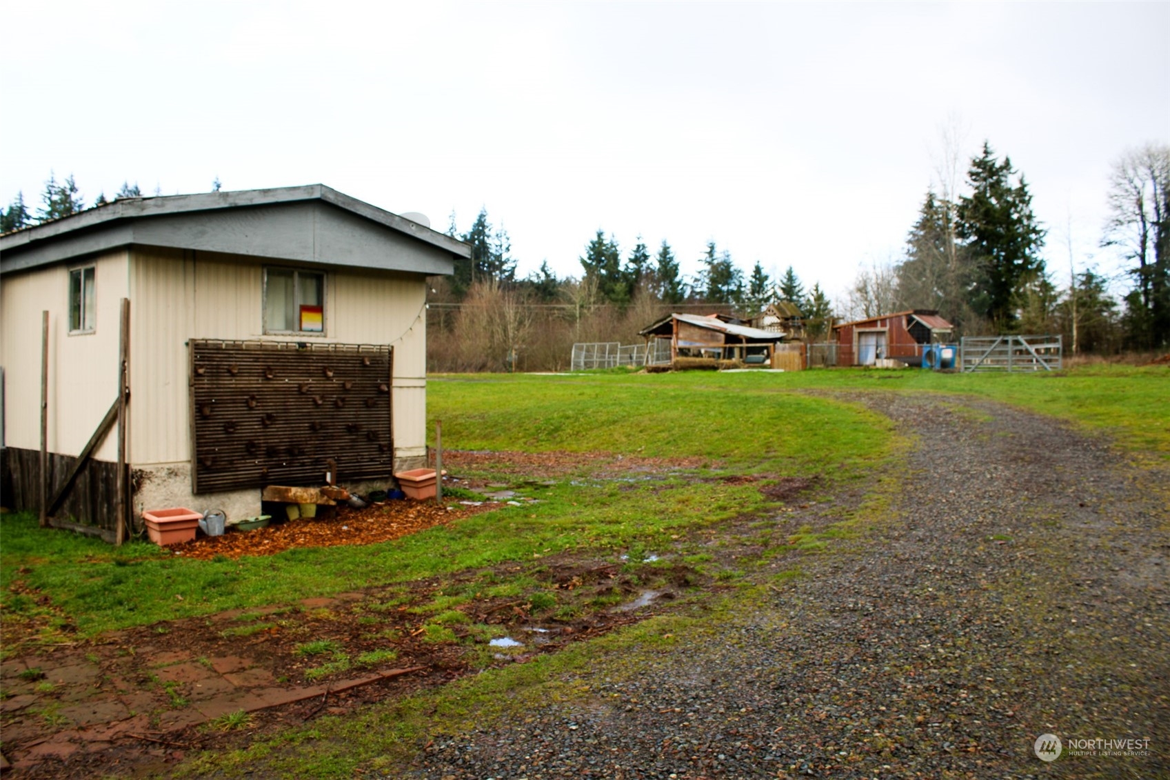 7608 Southwest Scatter View Lane Rochester, WA 98579 - Photo 8 of 23 a backyard of a house with lots of green space