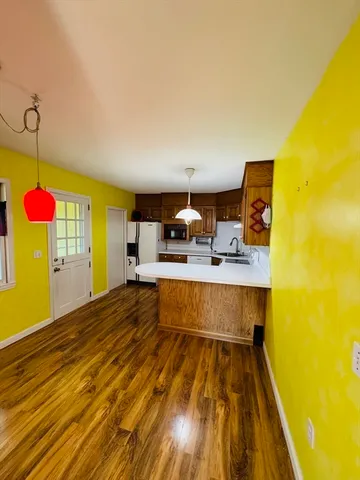 a view of kitchen and dining room with furniture