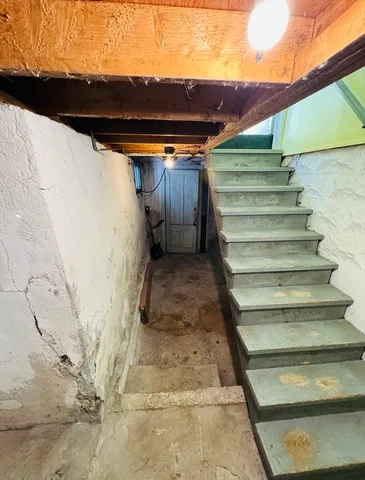 a view of an empty room with a fireplace