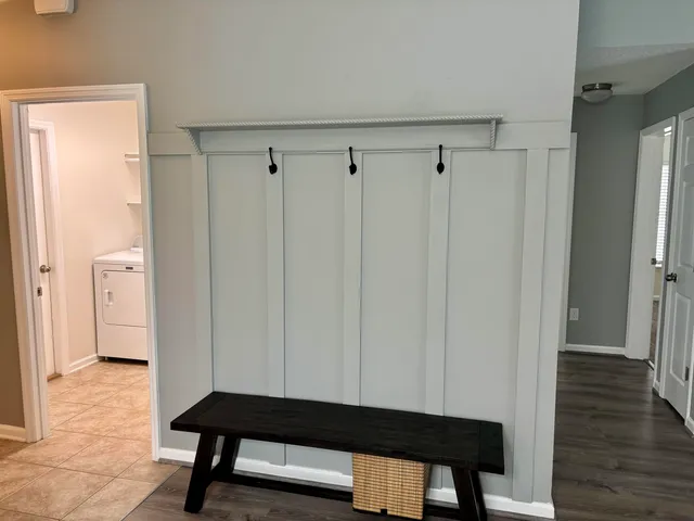 a room with glass door and furniture