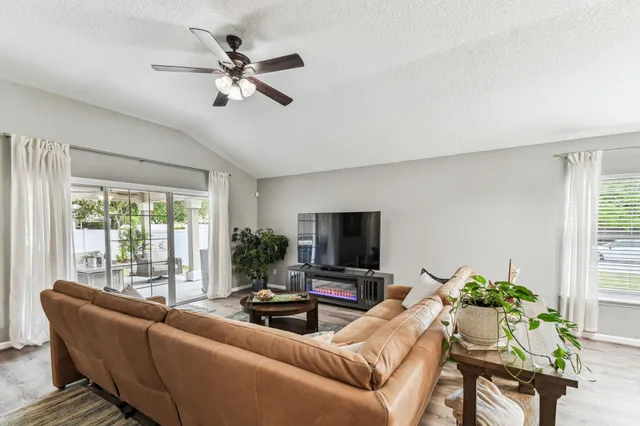 a bedroom with a bed and a potted plant