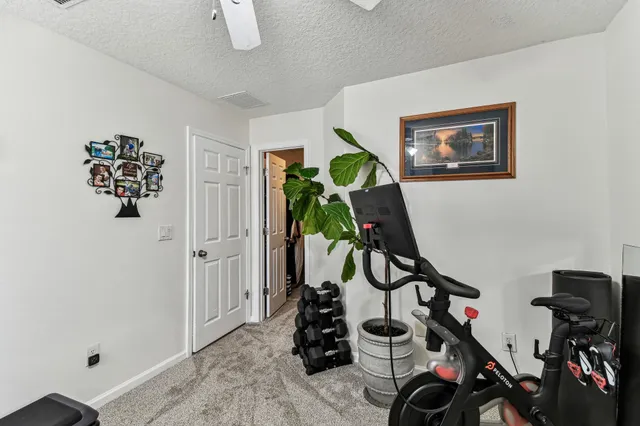 a view of a house with a yard and sitting area