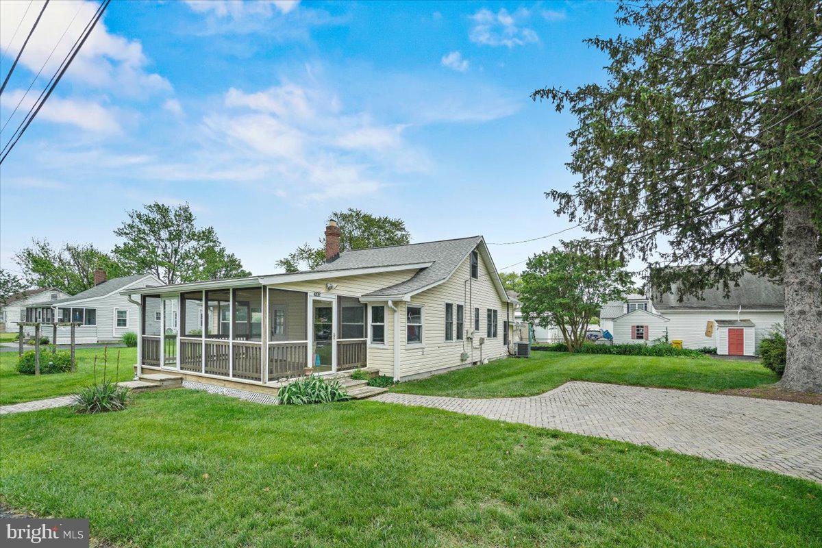 3963 Ramsey Drive Edgewater, MD 21037 - Photo 4 of 4 a front view of a house with a yard