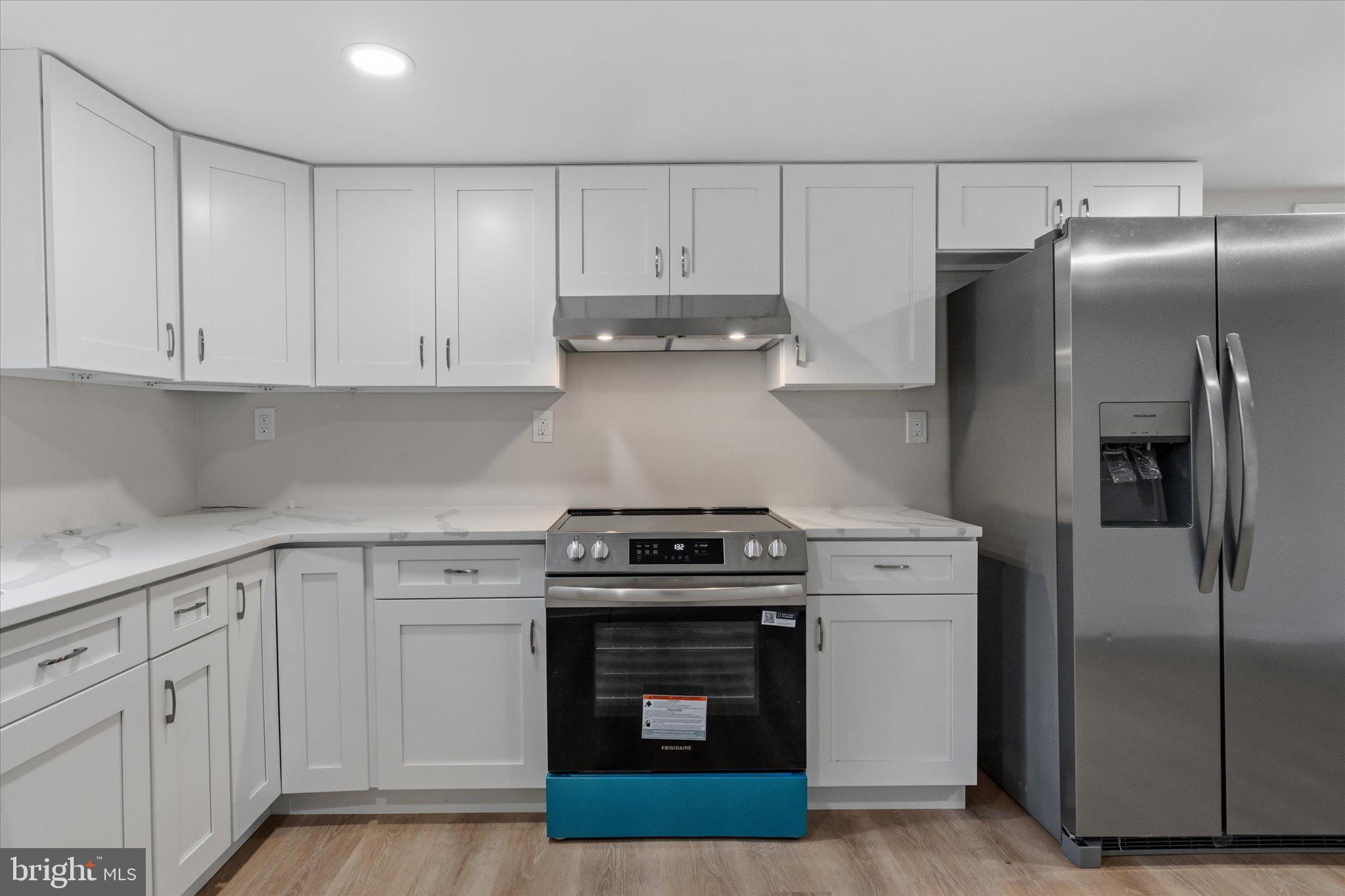 831 Deturksville Road Pine Grove, PA 17963 - Photo 4 of 24 a kitchen with white cabinets and stainless steel appliances