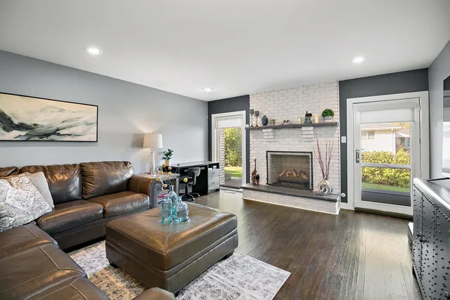 a living room with furniture and a fireplace