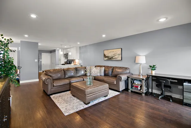 a living room with furniture and a table