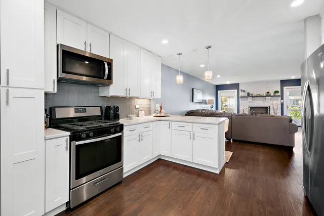 a kitchen with a stove and a microwave