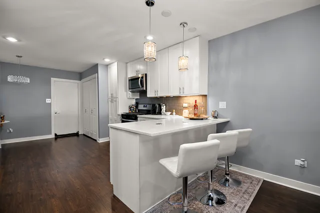 a view of kitchen and dining area with furniture