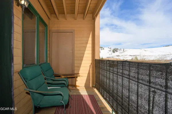 a view of balcony with furniture