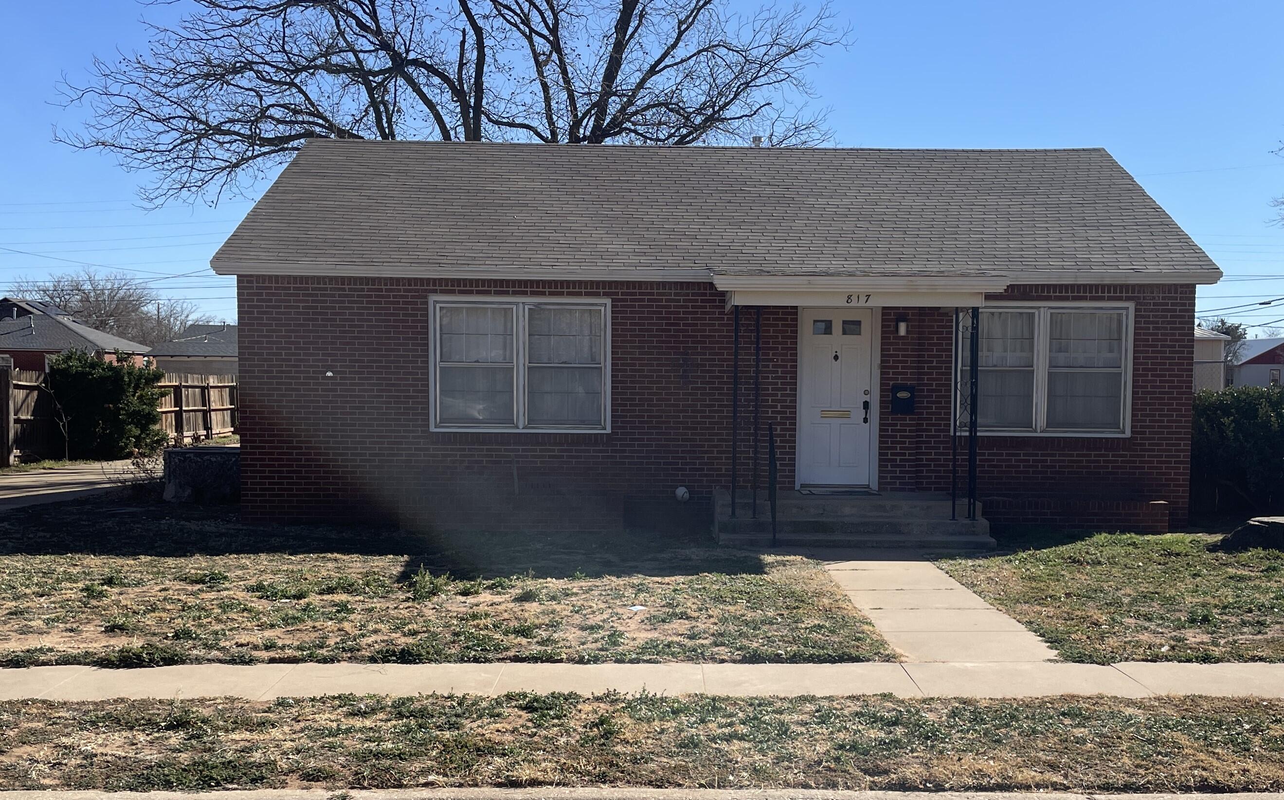 817 North 16th Street Lamesa, TX 79331 - Photo 1 of 12 a front view of a house with a yard