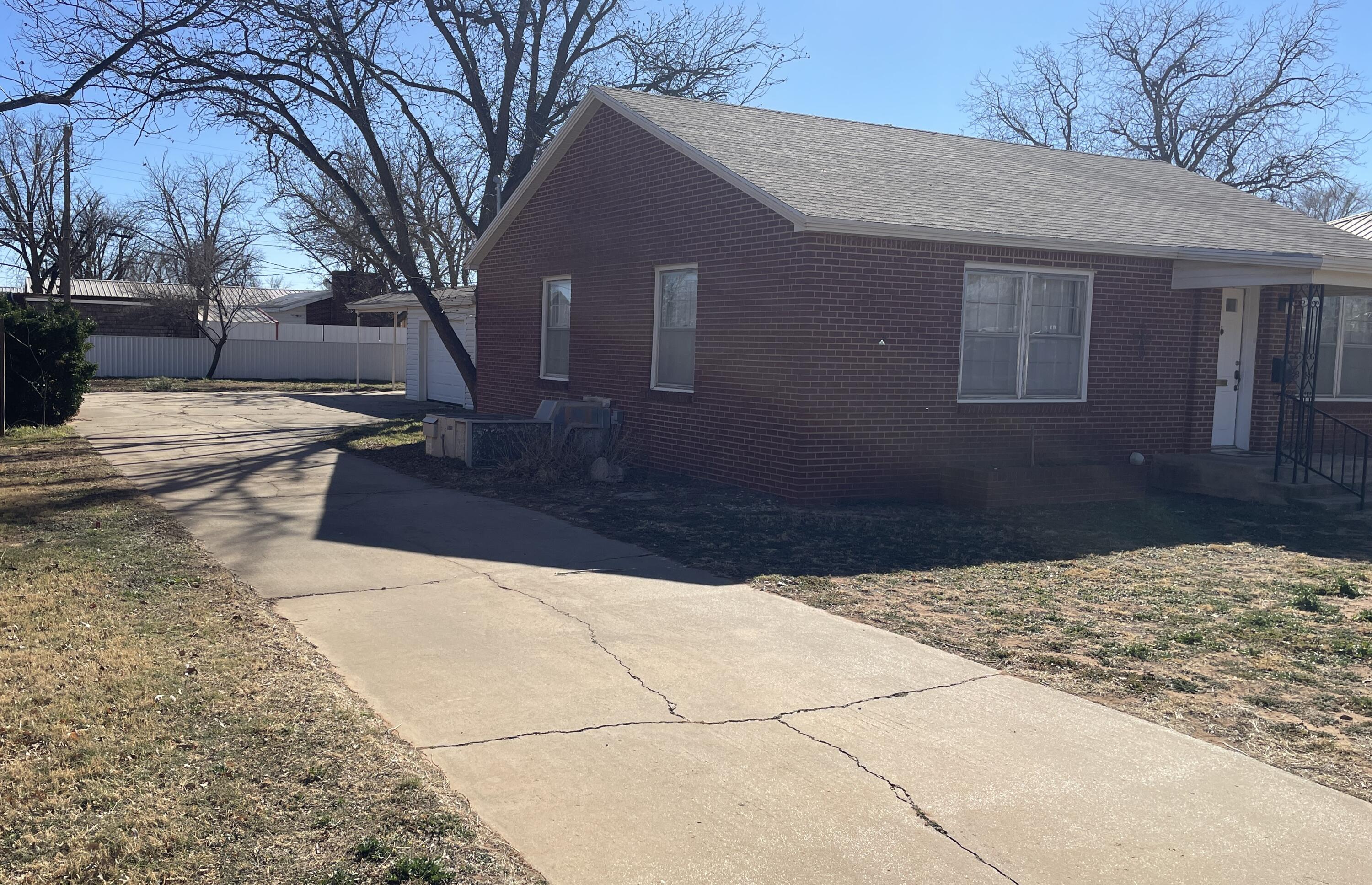 817 North 16th Street Lamesa, TX 79331 - Photo 2 of 12 a view of a house with a yard