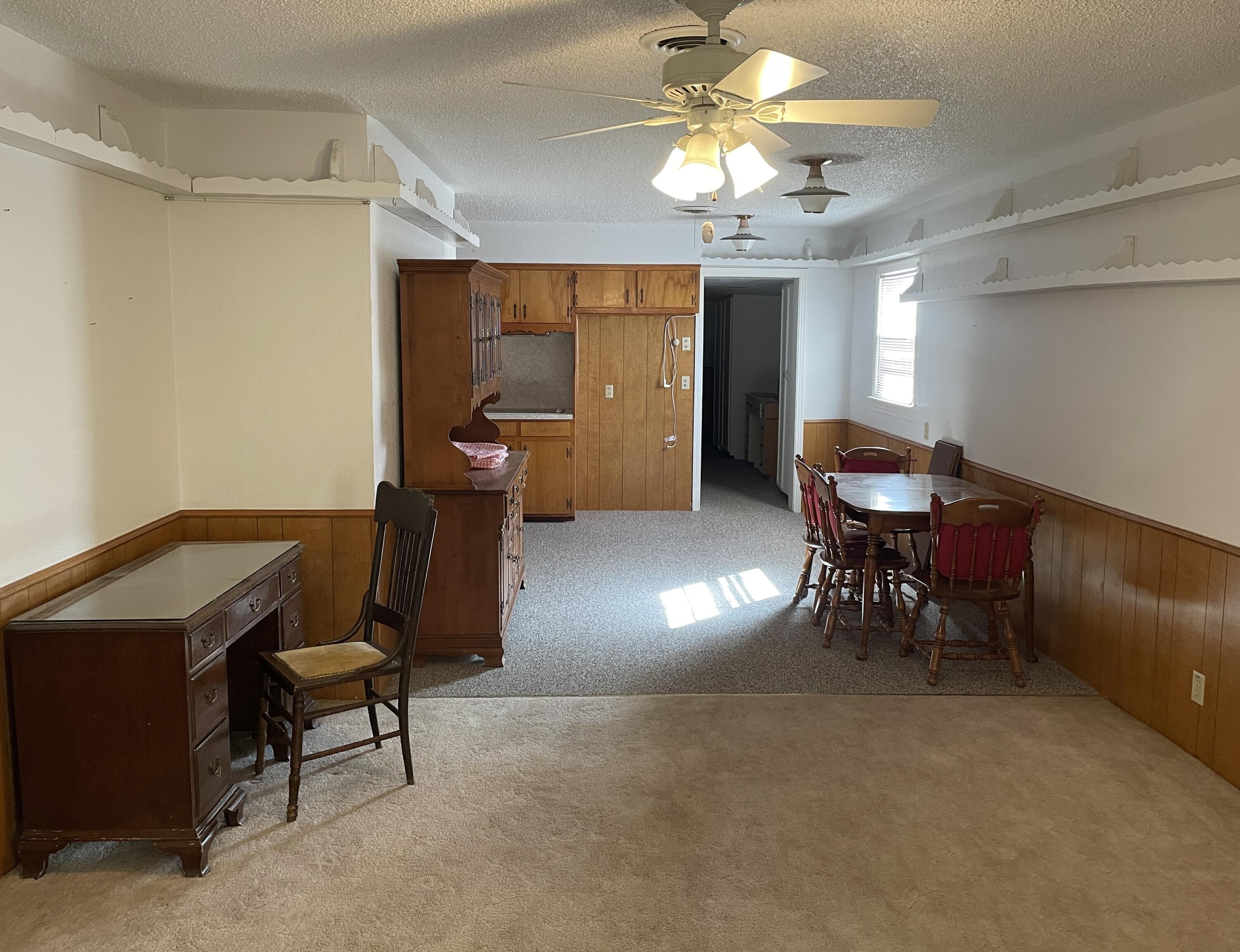 817 North 16th Street Lamesa, TX 79331 - Photo 5 of 12 a view of a livingroom with furniture and a chandelier