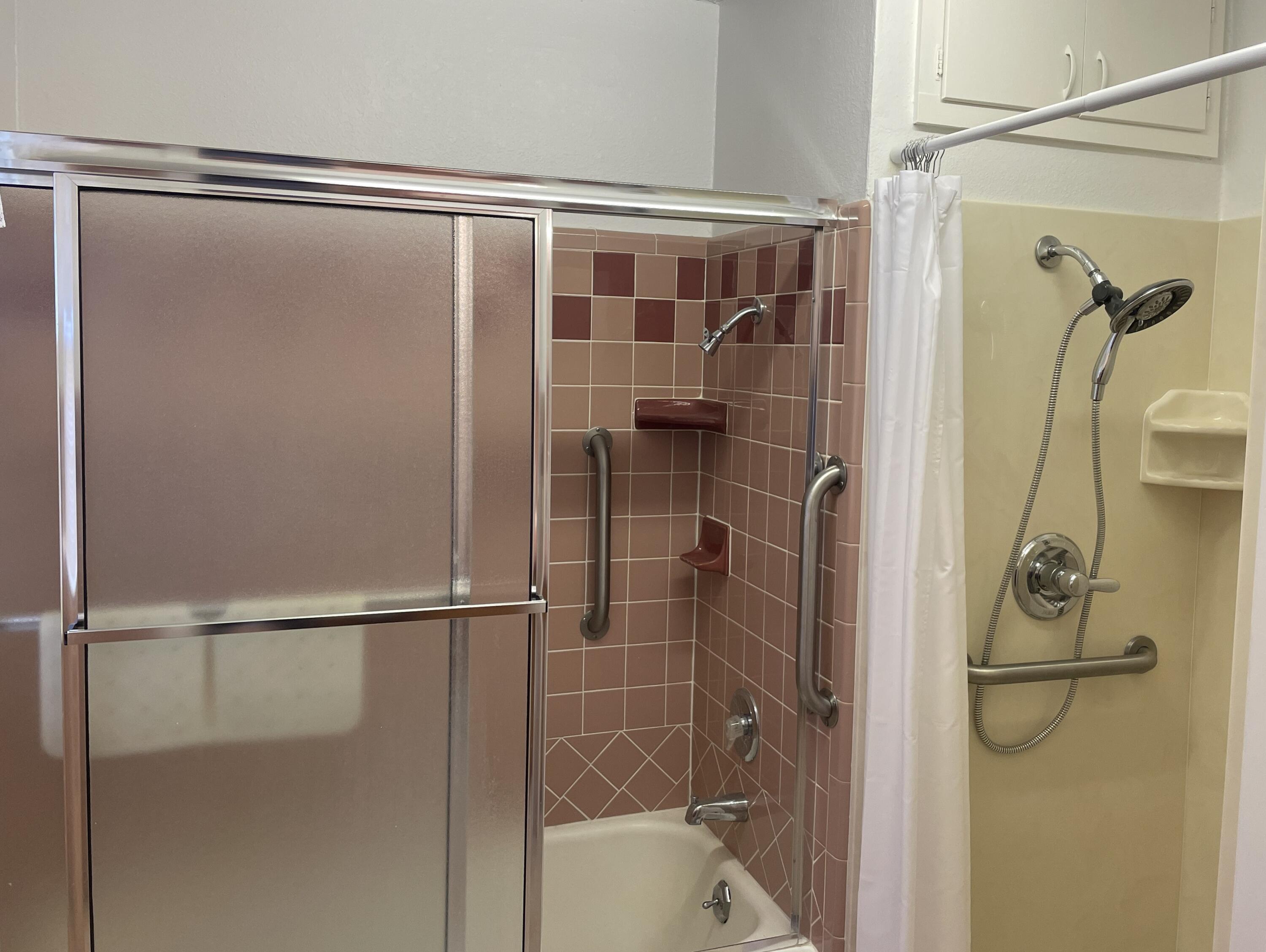 817 North 16th Street Lamesa, TX 79331 - Photo 10 of 12 a bathroom with a glass shower door