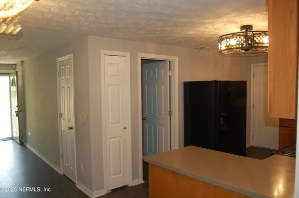 a bedroom with a bed and a mirror