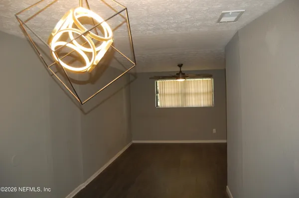 a bathroom with a mirror and a window
