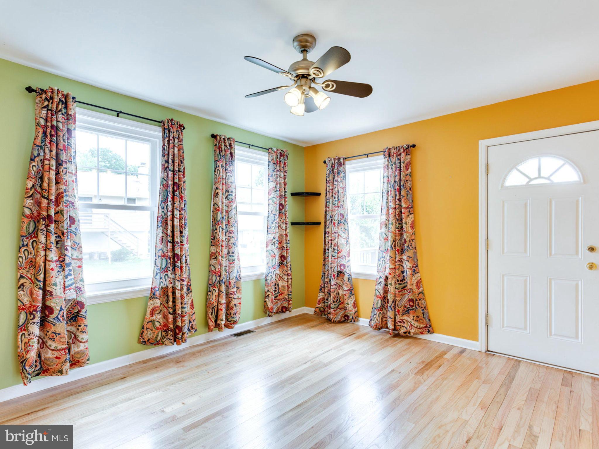 415 Rockway Road Catonsville, MD 21228 - Photo 11 of 30 a view of livingroom with hardwood floor and ceiling fan