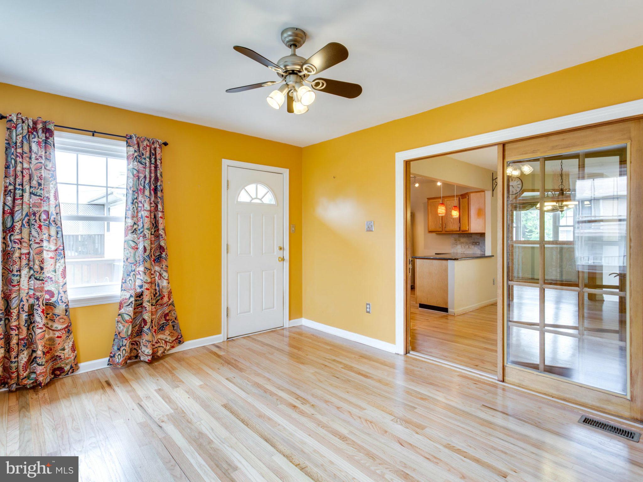 415 Rockway Road Catonsville, MD 21228 - Photo 12 of 30 a view of livingroom with hardwood floor and a ceiling fan