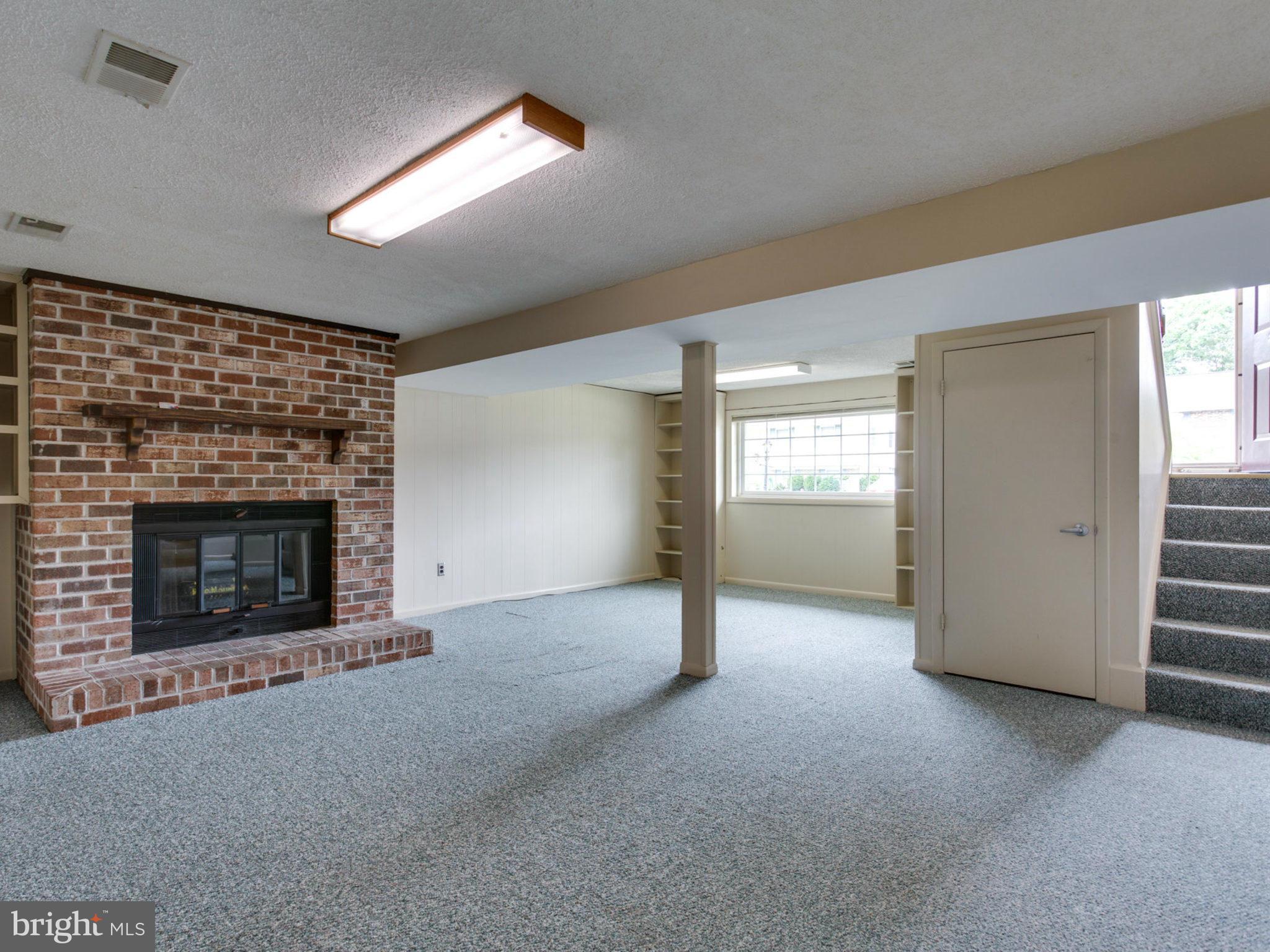 415 Rockway Road Catonsville, MD 21228 - Photo 20 of 30 a view of empty room with window and fireplace